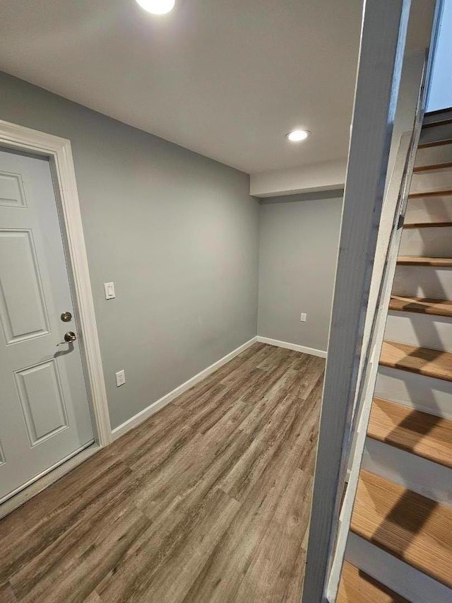 basement featuring hardwood / wood-style floors