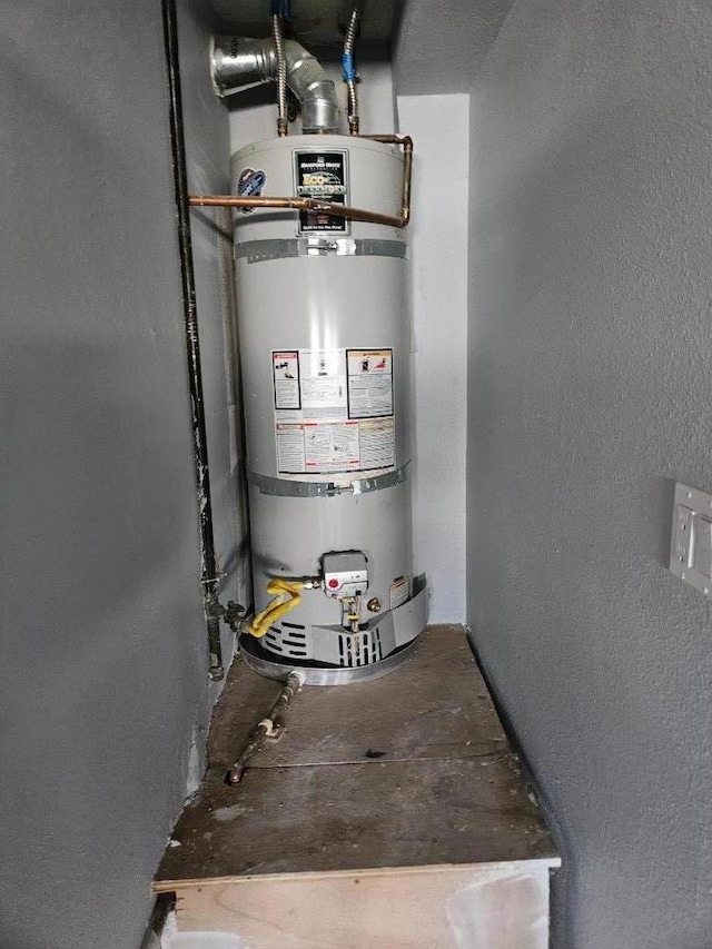 utility room with secured water heater