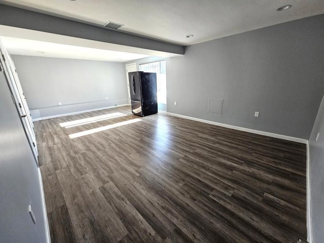 unfurnished living room featuring dark hardwood / wood-style flooring