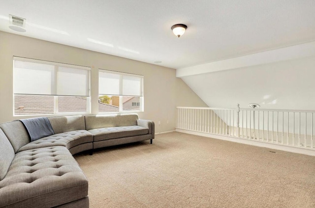 living room featuring vaulted ceiling and carpet flooring