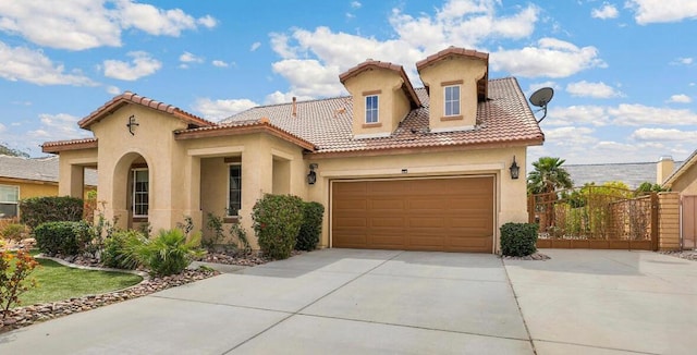 mediterranean / spanish-style home featuring a garage