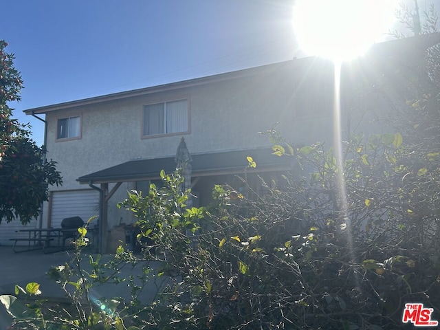 rear view of house with a patio