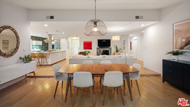 dining space with light wood-type flooring