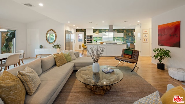 living room with light hardwood / wood-style flooring