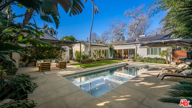 view of pool with an outdoor hangout area and a patio area