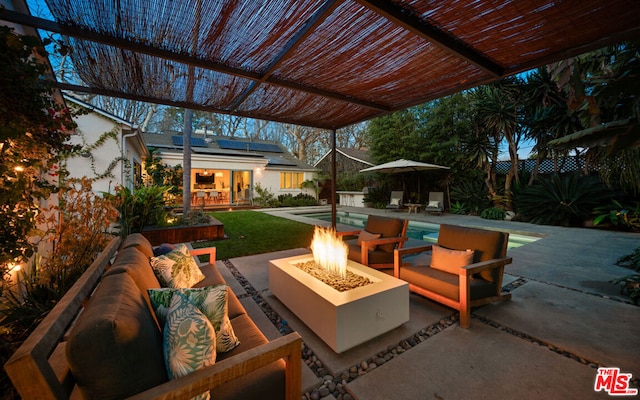 view of patio featuring an outdoor living space with a fire pit