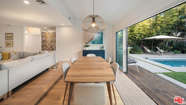 dining area featuring light wood-type flooring