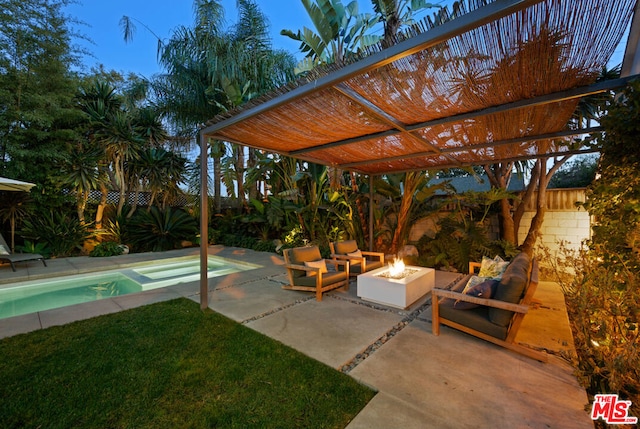 view of patio featuring an outdoor living space with a fire pit