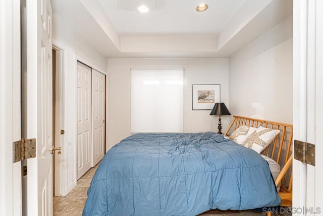 bedroom featuring a raised ceiling