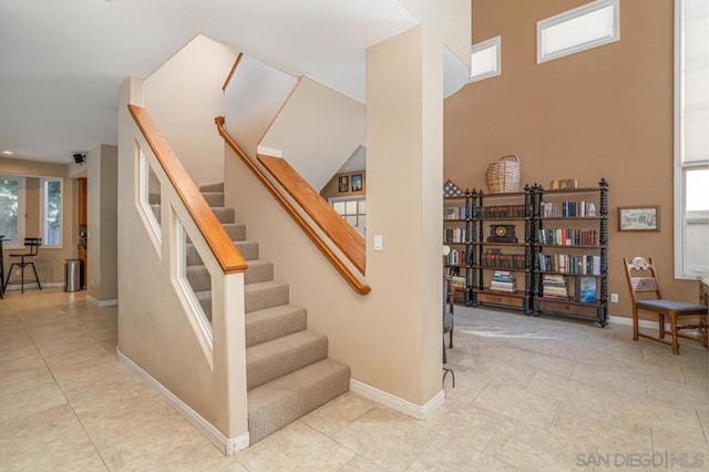 stairs with tile patterned floors