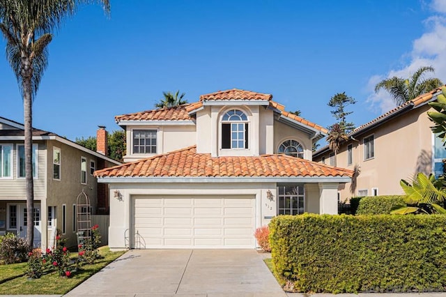 mediterranean / spanish home featuring a garage