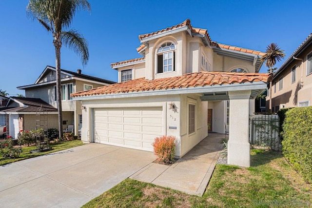 mediterranean / spanish house with a garage