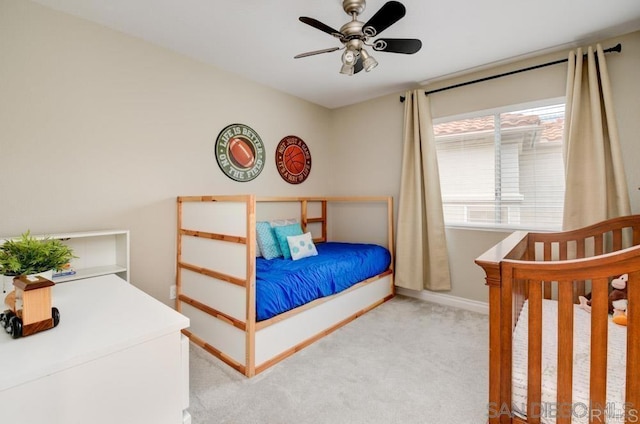 carpeted bedroom featuring ceiling fan