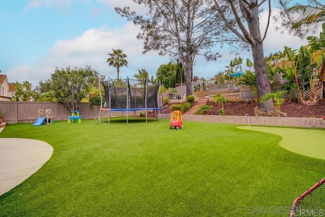 view of yard with a trampoline