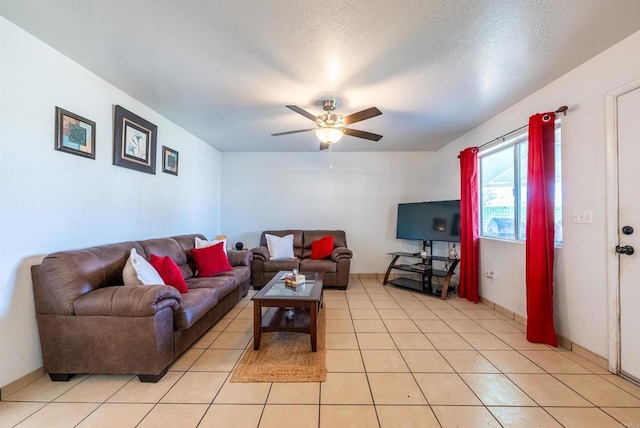 tiled living room with a textured ceiling and ceiling fan