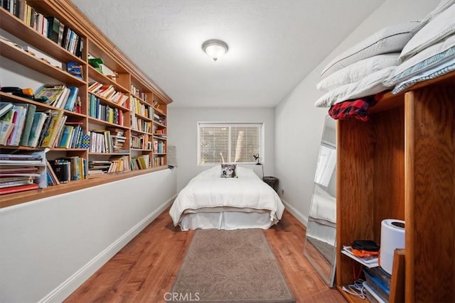 bedroom featuring wood-type flooring