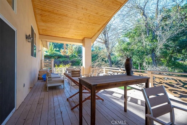 wooden deck with an outdoor hangout area