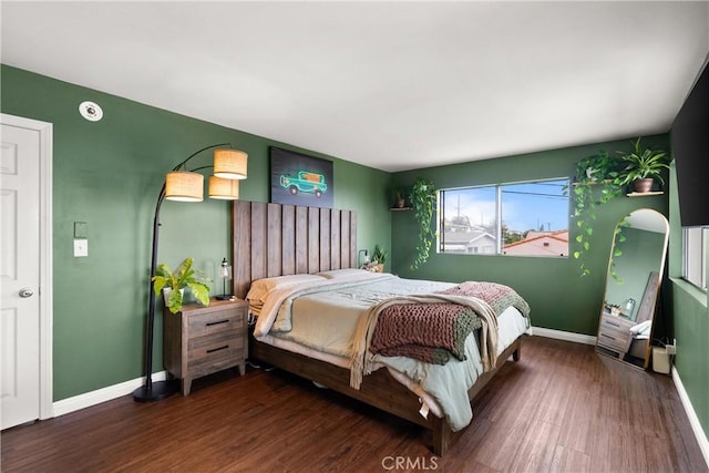 bedroom featuring dark hardwood / wood-style flooring