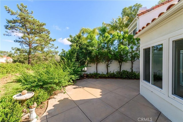 view of patio featuring fence