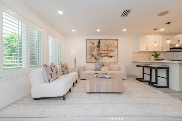 living room with light hardwood / wood-style floors