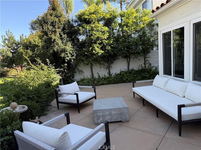 view of patio / terrace featuring fence and an outdoor hangout area