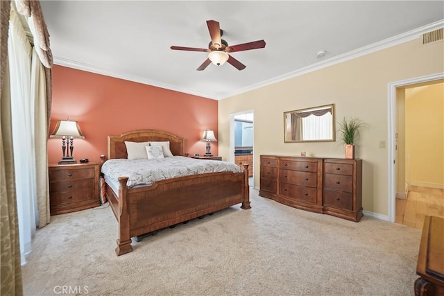 bedroom featuring ceiling fan, ornamental molding, and light carpet