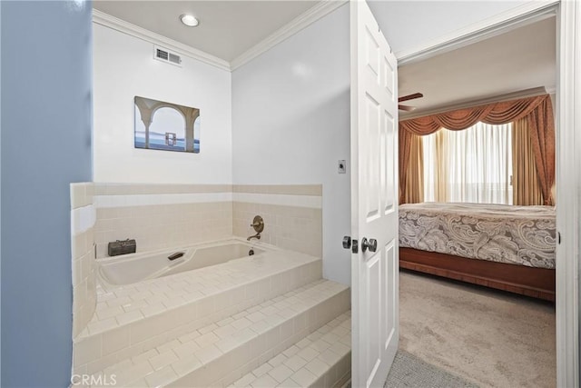 bathroom featuring tiled tub and ornamental molding