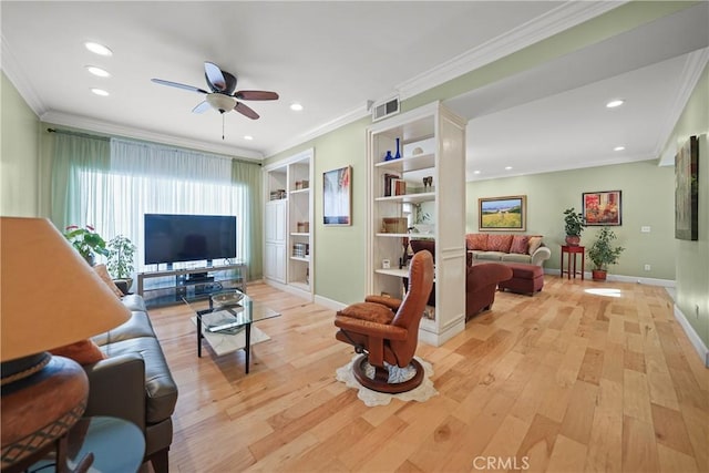 living room with ceiling fan, ornamental molding, built in features, and light hardwood / wood-style flooring