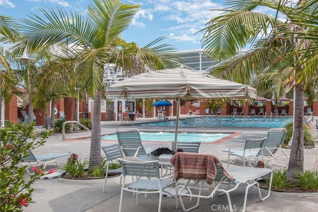 view of swimming pool featuring a patio area