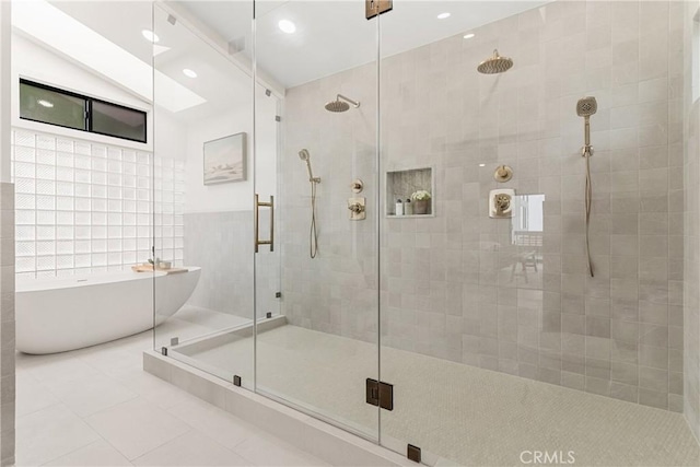 bathroom with tile patterned floors and plus walk in shower