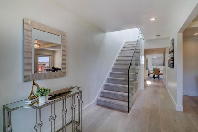 stairway featuring hardwood / wood-style flooring