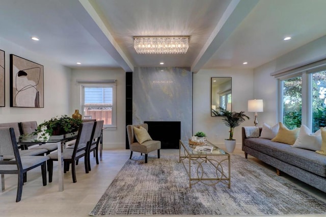 living room featuring a high end fireplace