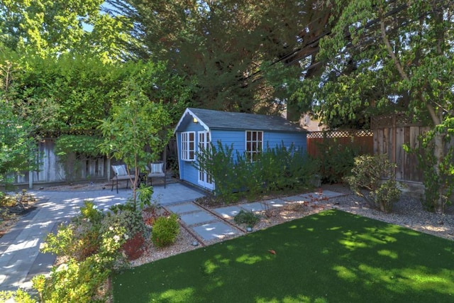 view of outdoor structure featuring a lawn