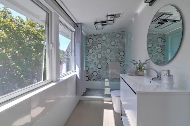 bathroom with vanity and walk in shower