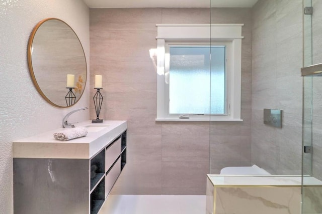 bathroom with a shower and vanity