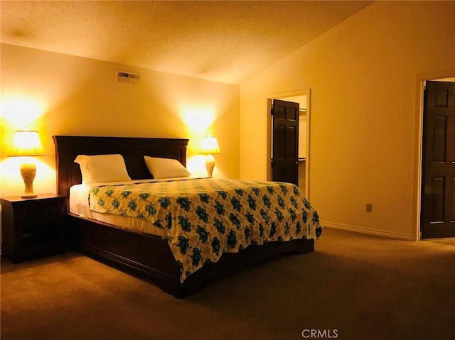 carpeted bedroom featuring lofted ceiling and a textured ceiling