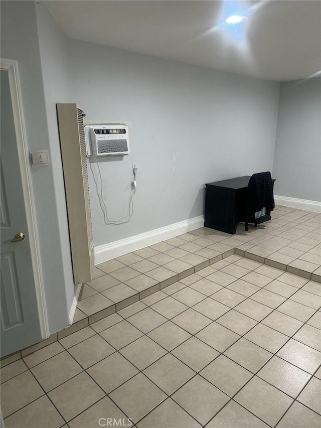 interior space featuring a wall mounted air conditioner and light tile patterned floors