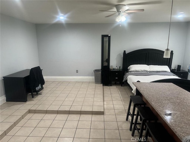 bedroom with light tile patterned floors and ceiling fan