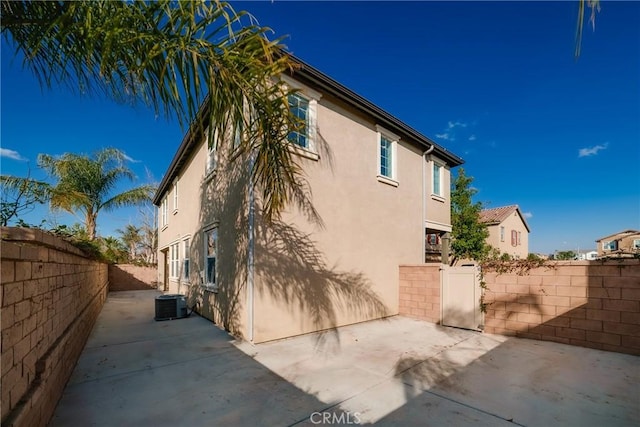 view of side of property featuring a patio