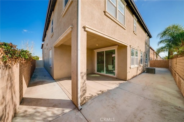 back of property featuring a patio