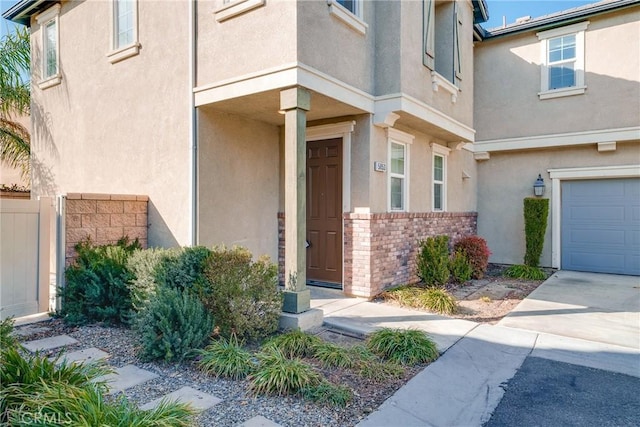 view of exterior entry with a garage