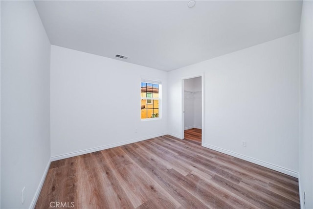 unfurnished room featuring light hardwood / wood-style flooring