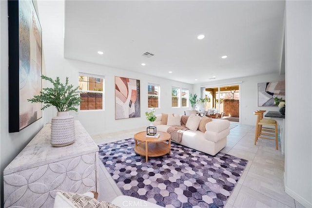 living room featuring light tile patterned flooring