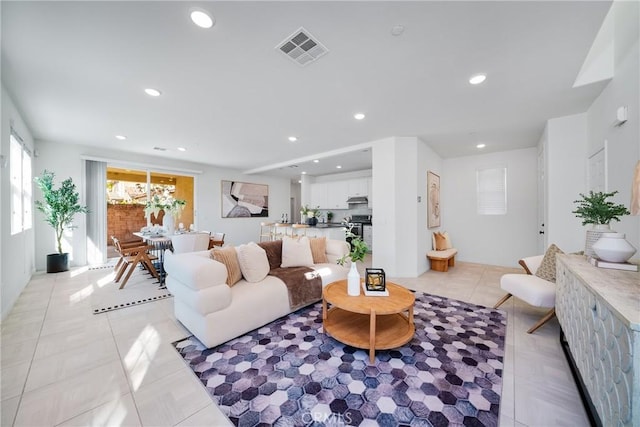 living room with light tile patterned floors