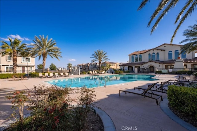 view of swimming pool featuring a patio area