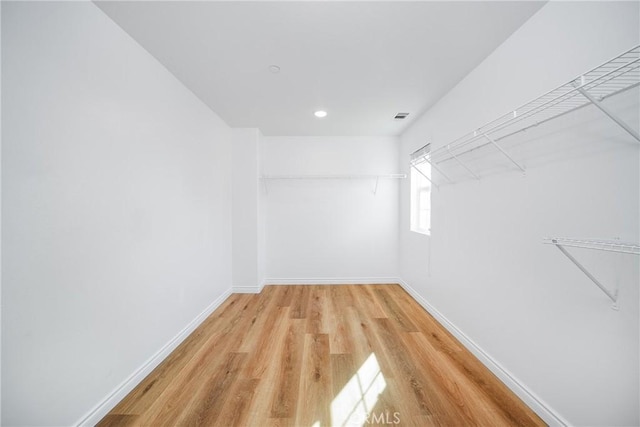 walk in closet featuring wood-type flooring