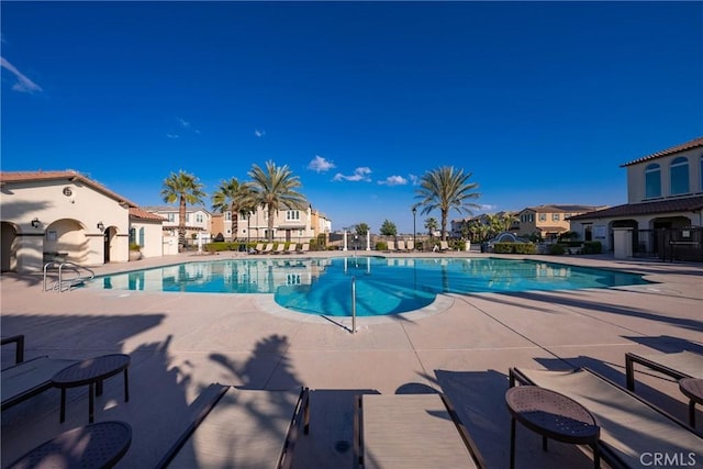 view of swimming pool with a patio