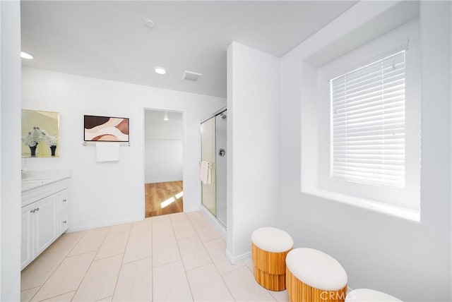 bathroom with vanity and walk in shower