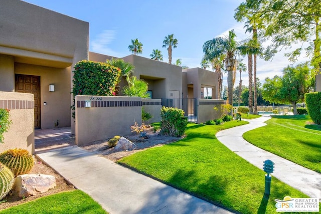 view of home's community featuring a yard