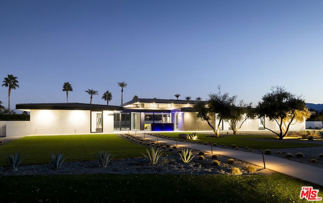 view of front of house with a lawn